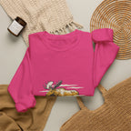 Heliconia North Woods Moose Crewneck laid flat next to a woven basket and knit blanket
