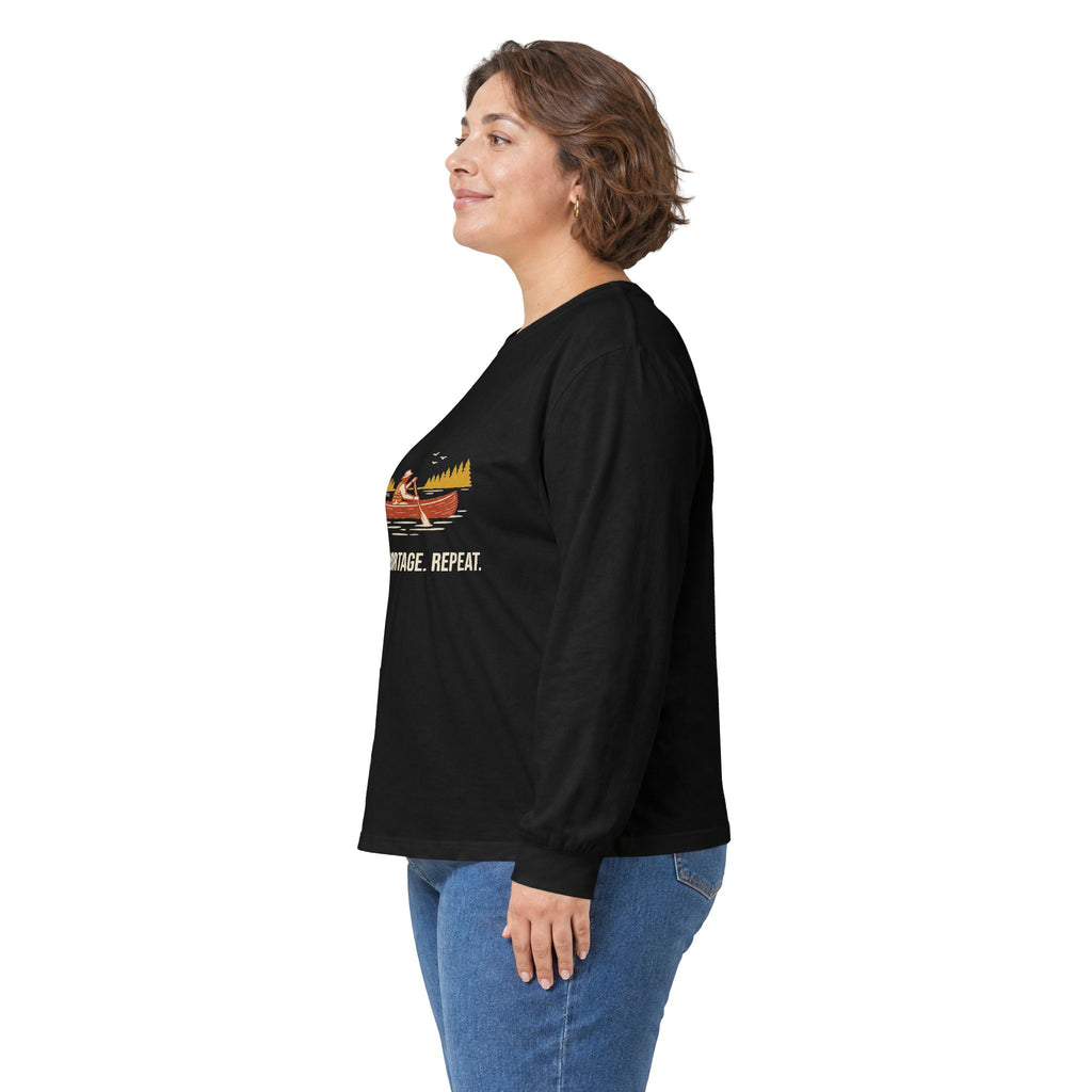 Model wearing the Black Paddle Portage Long Sleeve Tee, side view