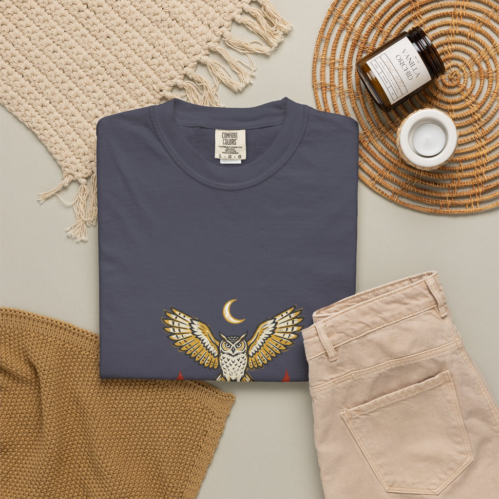 Navy After Dark Owl Tee laid flat next to a woven basket and folded clothes