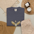 Navy After Dark Owl Tee laid flat next to a woven basket and folded clothes