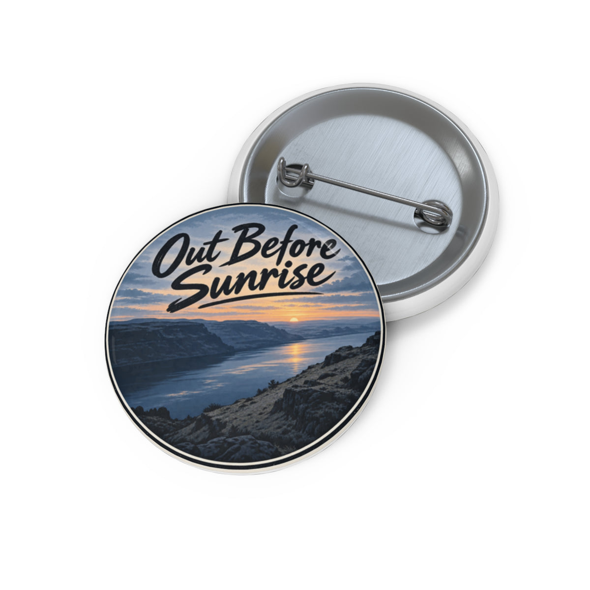 Out Before Sunrise pin button with a river canyon at sunrise, shown front and back