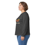Model wearing the Dark Heather Paddle Portage Long Sleeve Tee, side view