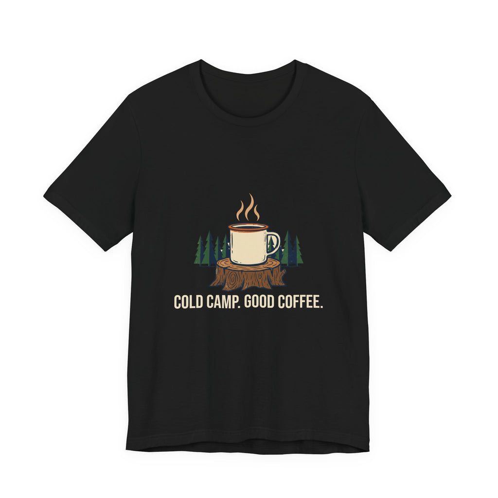 Cold Camp, Good Coffee Tee in Black, front view with a steaming enamel mug on a pine stump above the words 'Cold Camp. Good Coffee.'