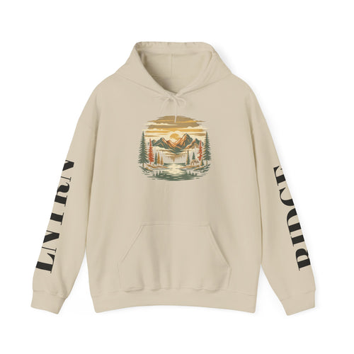 Mountain Lake Hoodie in Sand, front view with a vintage mountain lake and evergreen graphic on the chest and lettering down the sleeves